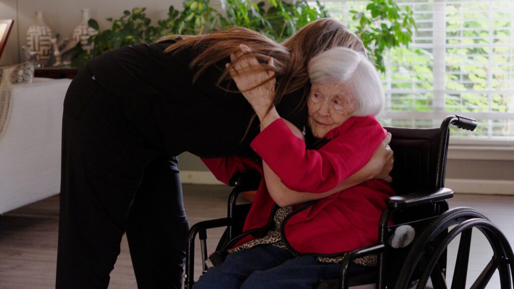 A nurse hugs a respite care patient at Pioneer